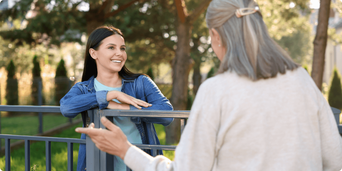 Teen and neighbor working together